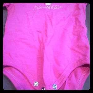 Pink Calvin Klein onesie